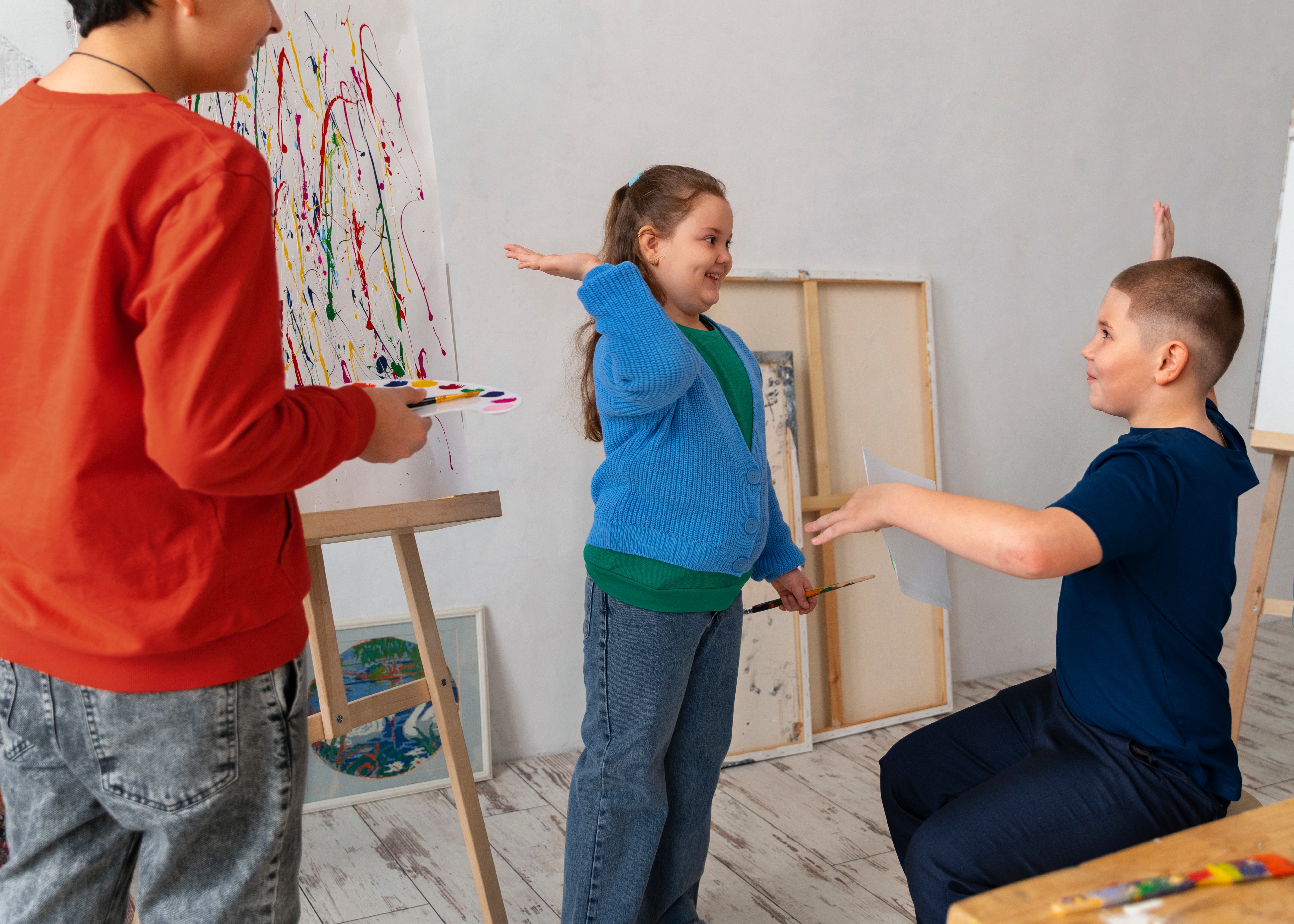side-view-kids-painting-school