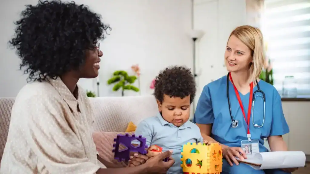 caregiver-and-child-meeting-with-pediatric-provider-at-home