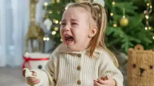 crying-toddler-during-holiday-family-moment-at-home