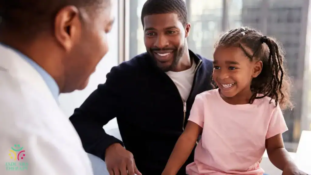 father-and-daughter-smiling-during-pediatric-doctor-visit