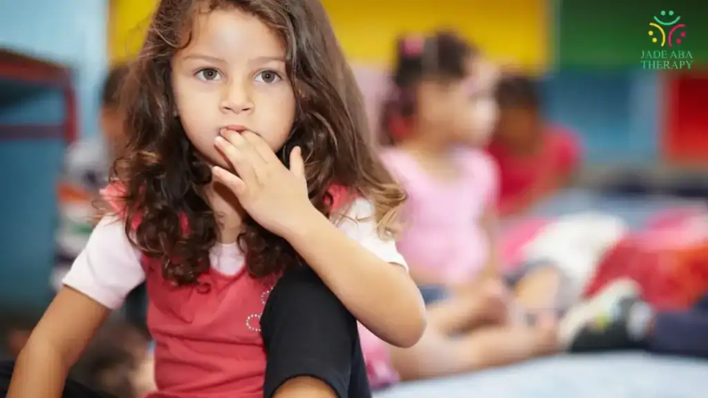young-girl-sitting-thoughtfully-in-classroom-setting